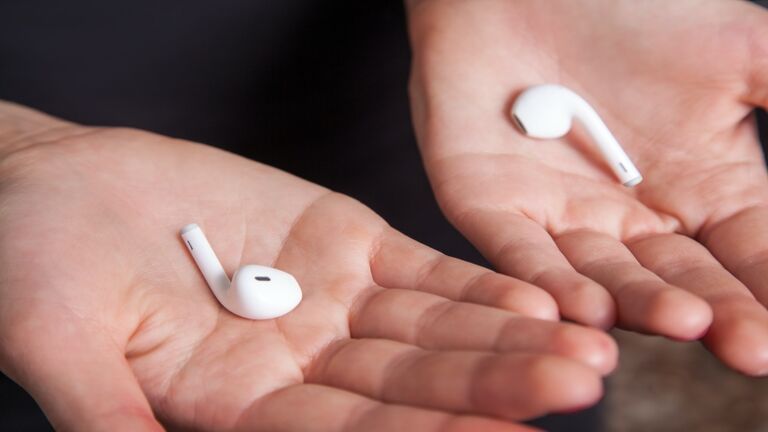 Young woman with wireless earphones
