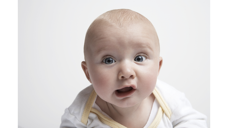 Baby boy (3-6 months) looking at camera, portrait