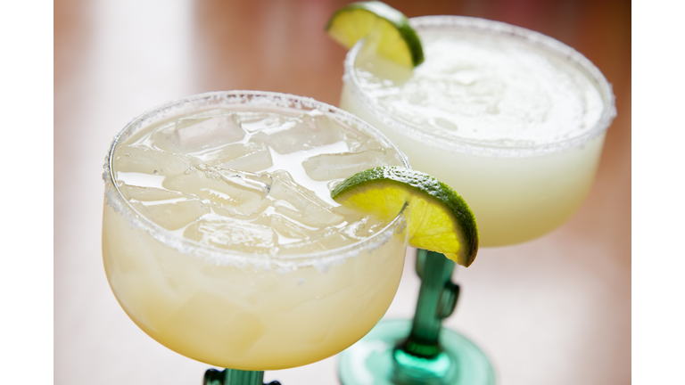 Two glasses of classic margarita: on the rocks and blended