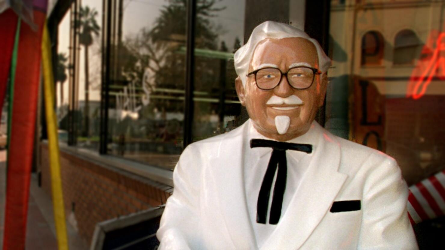 ME.Downtown.Colonel.010997.MB(Orange)A lifesize statue of Colonel Sanders greets customers walkin