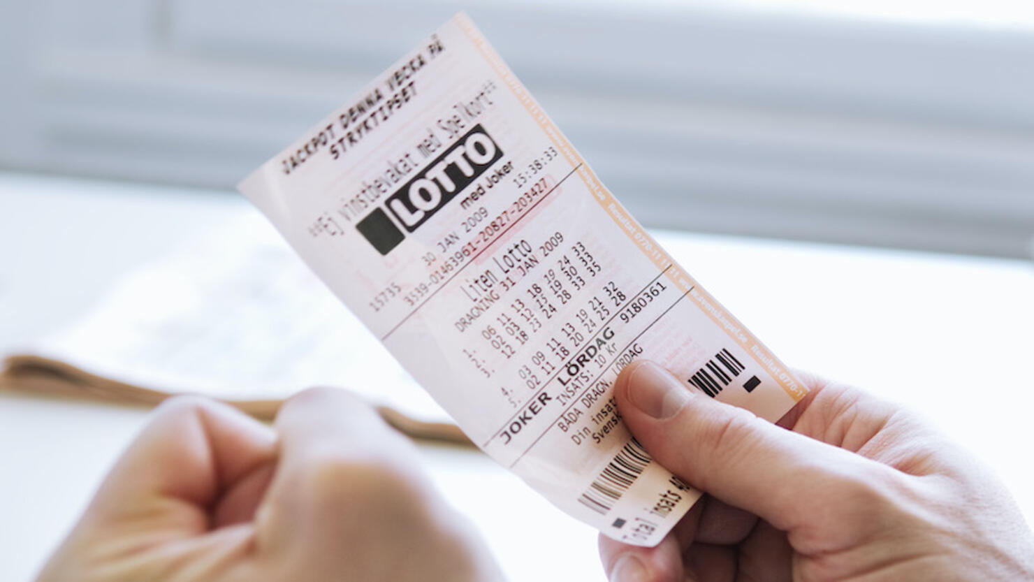 Man with lottery ticket