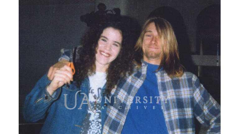Tessa Osbourne and Kurt Cobain pose during a haircut in 1989