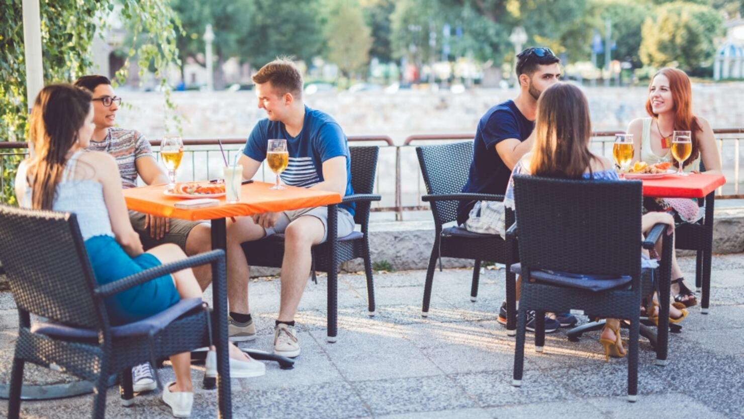 Young people relaxing in patio section