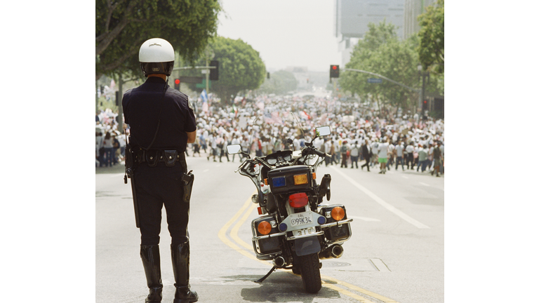 Police in front of crowd for Immigration Bill Rally in Los Angeles