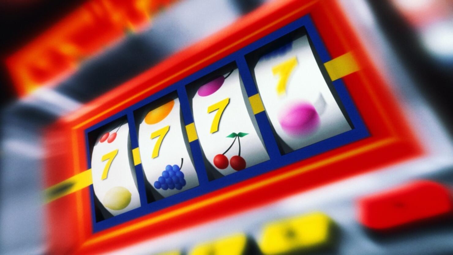 Fruit machine bars spinning to line of 7's (Digital Composite)