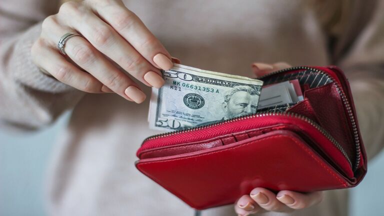 Midsection Of Woman Holding Purse