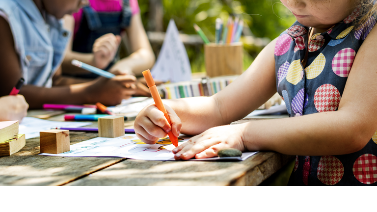 Group of kindergarten kids friends drawing art class outdoors