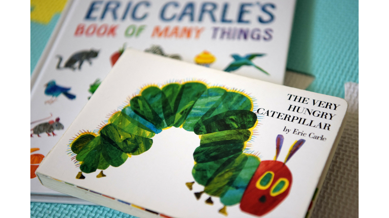 This photo illustration taken on May 26, 2021 shows Eric Carle's "The Very Hungry Caterpillar" and "Book of Many Things" in Los Angeles, California