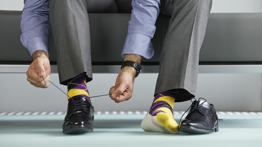 He s his shoes. Money in Shoe. Tied Shoe. Old man tying Shoelaces.