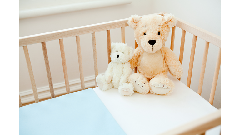 Teddy bears on crib