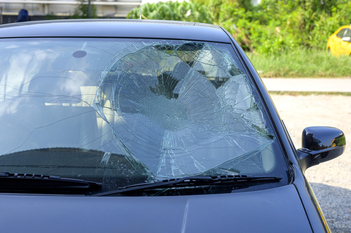 Broken car windshield in car accident.