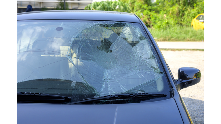 Broken car windshield in car accident.