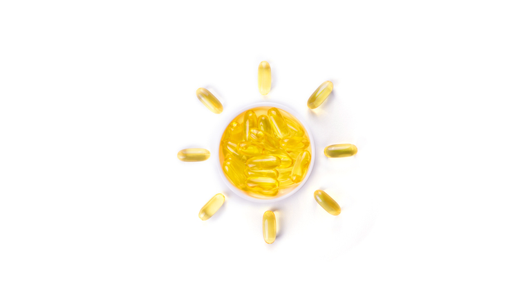 Fish oil supplements in a shape of a sun.