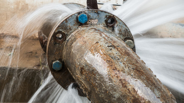 metal pipe with valve is leaking in water treatment plant