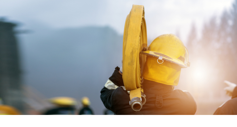 Fireman training Spray water for helped stop the fire. Fire in the Industrial Factory . Rescue ,Education ,Emergency and Teamwork concept .