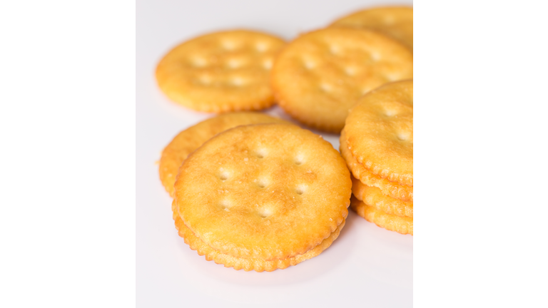 Salt cracker on white background.