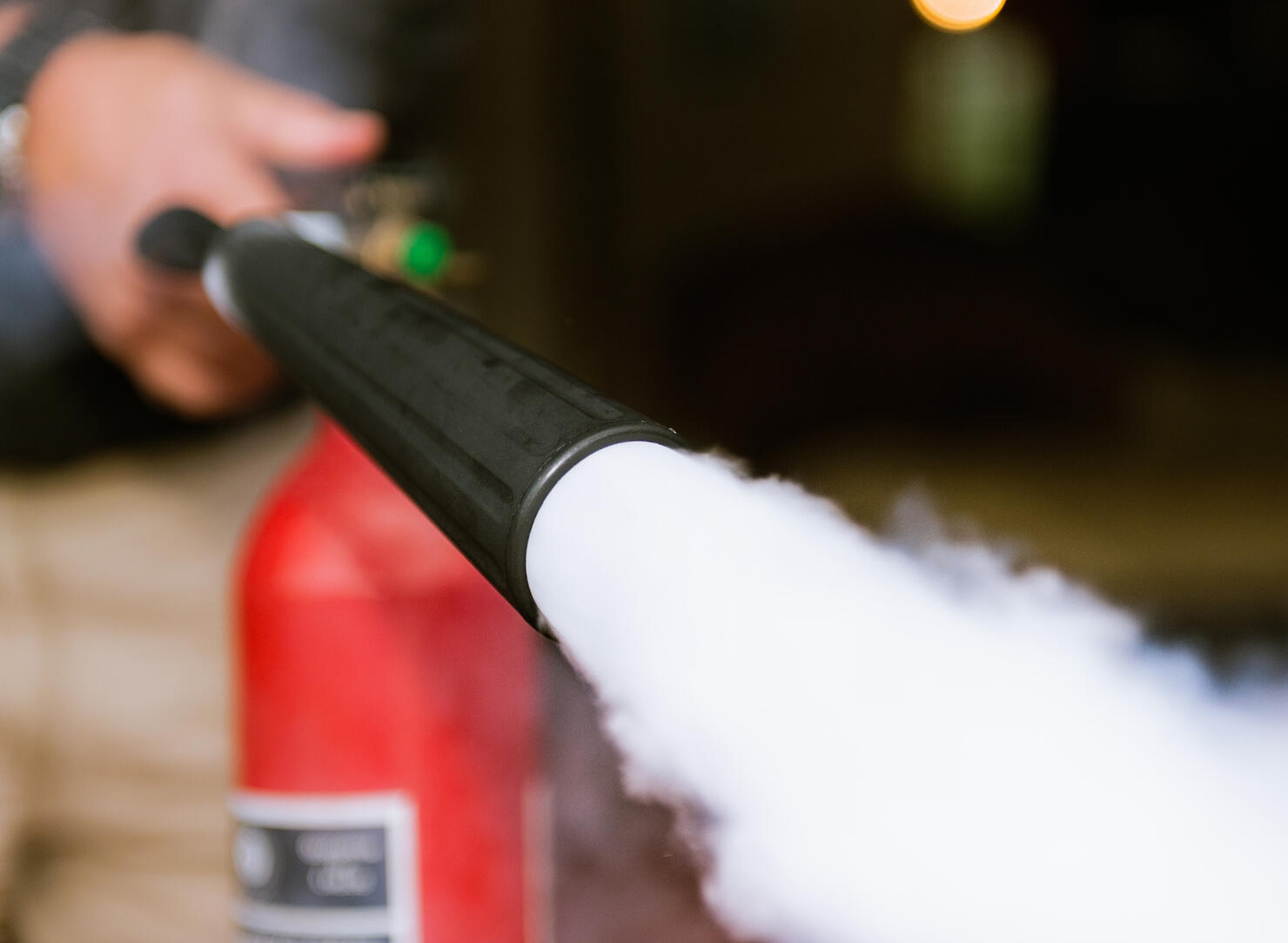 Fire extinguisher being used indoors