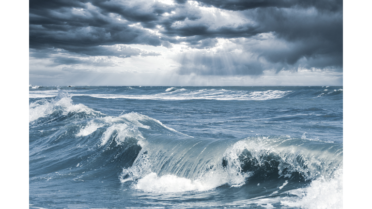 Surf waves seascape during tropical cyclone extreme weather storm