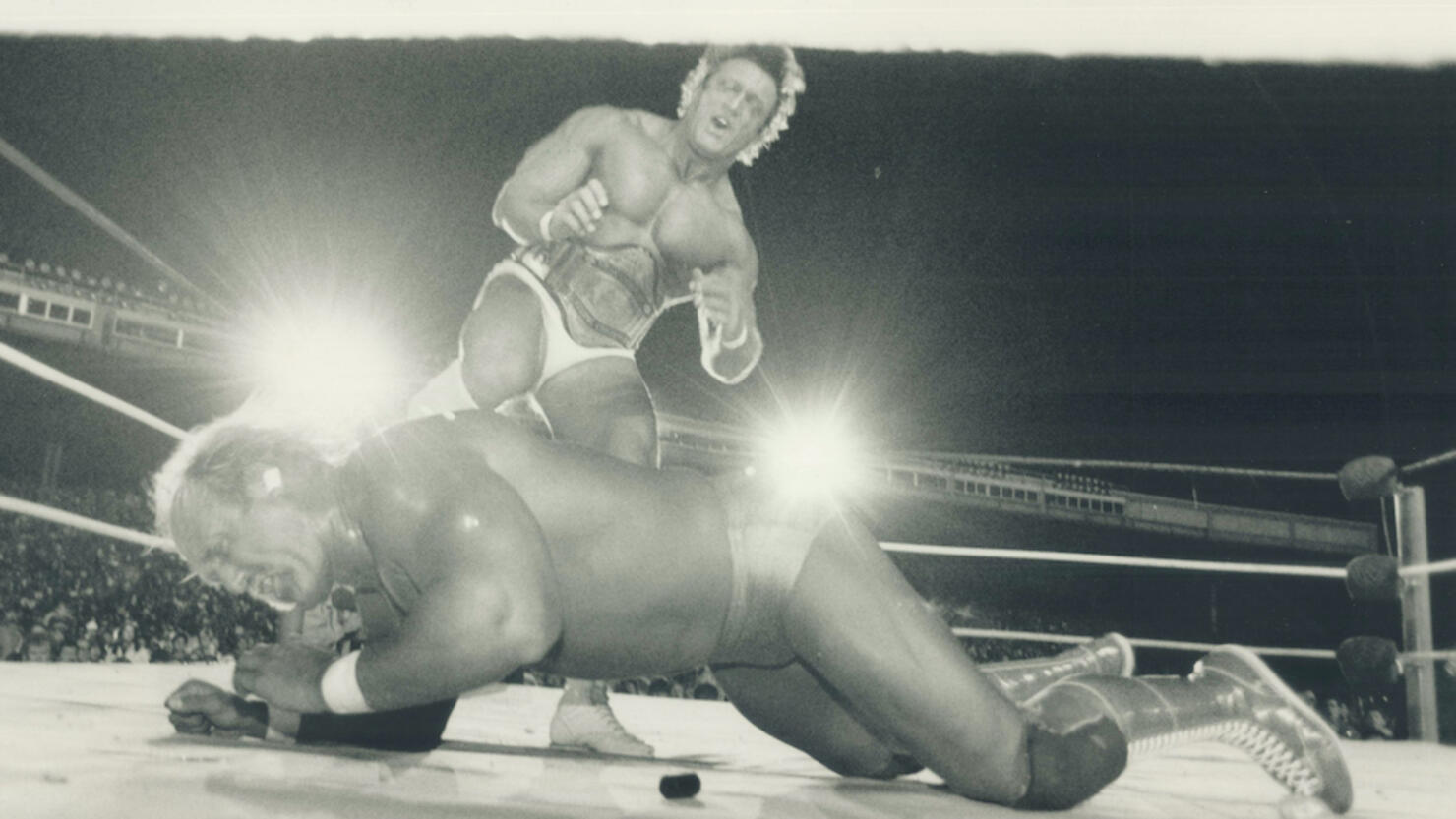 Ooh; that hurts: Hulk Hogan grimaces as he takes a well-placed boot in the ribs from Paul (Pretty Bo