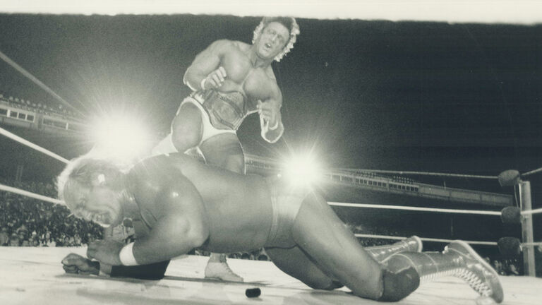 Ooh; that hurts: Hulk Hogan grimaces as he takes a well-placed boot in the ribs from Paul (Pretty Bo
