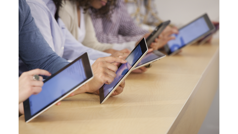 Students using digital tablets