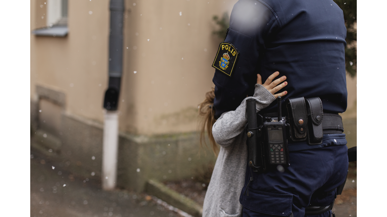 Police woman hugging daughter