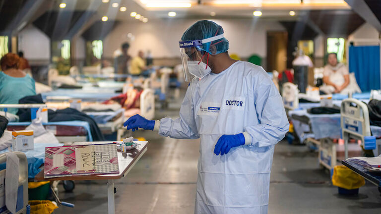 A doctor wearing a Personal Protective Equipment suite (PPE