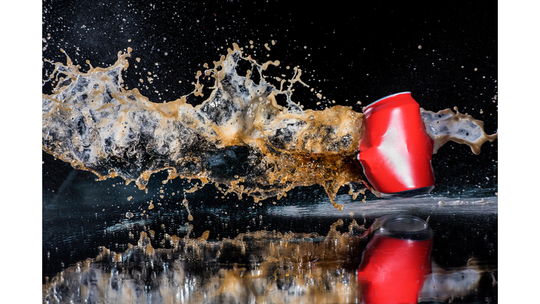 Red Tin Can Of Containing a Soft Drink Exploding