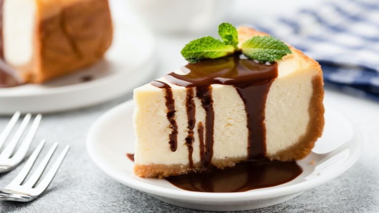 Cheesecake with chocolate sauce on plate