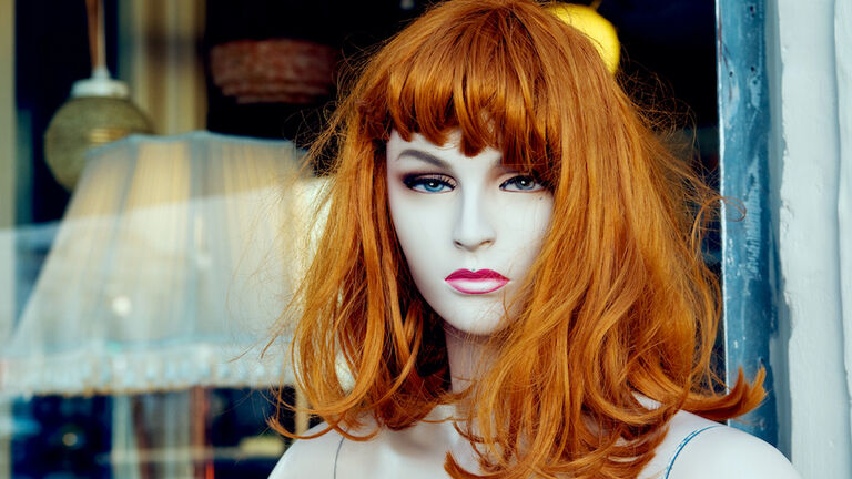 Mannequin with a red wig