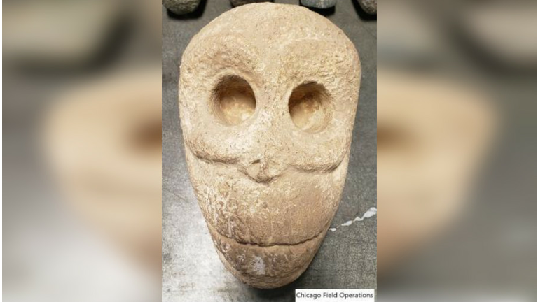 A human skull carved from stone. 