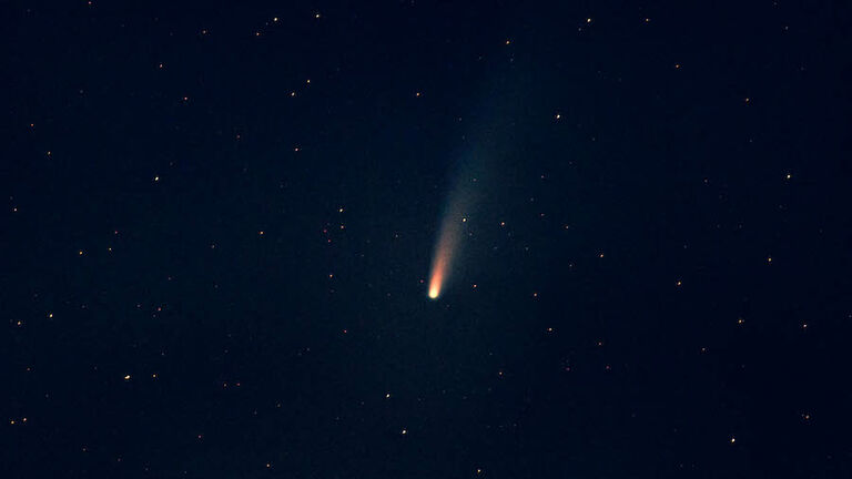 Stargazing the C/2020 F3 NEOWISE comet during night with stars.