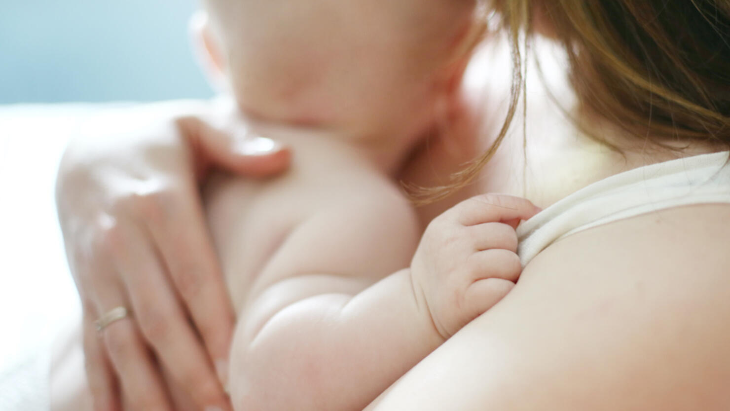 A baby in the arms of his mum