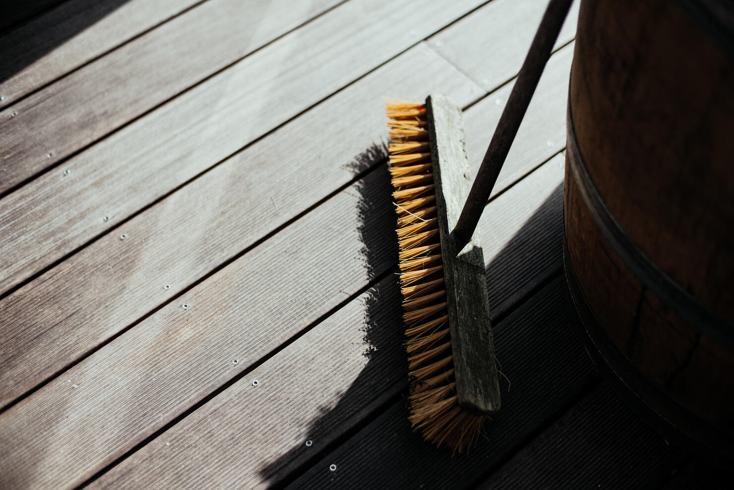 High Angle View Of Broom On Wooden Floor