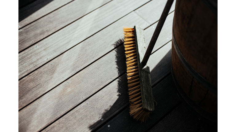 High Angle View Of Broom On Wooden Floor
