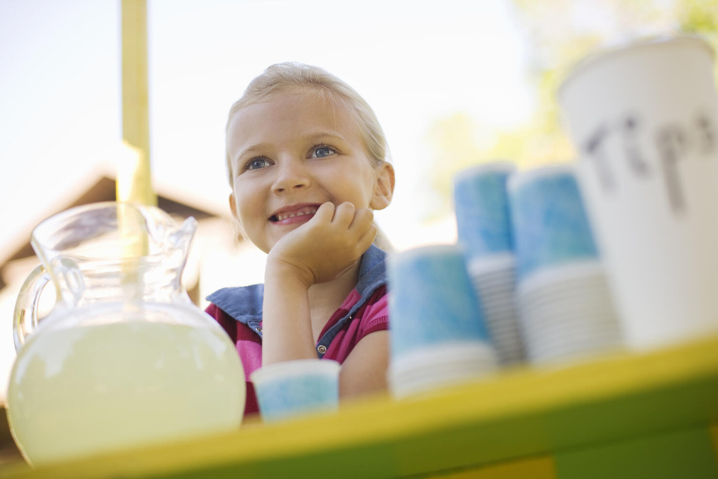 Smiling girl at lemonade stand