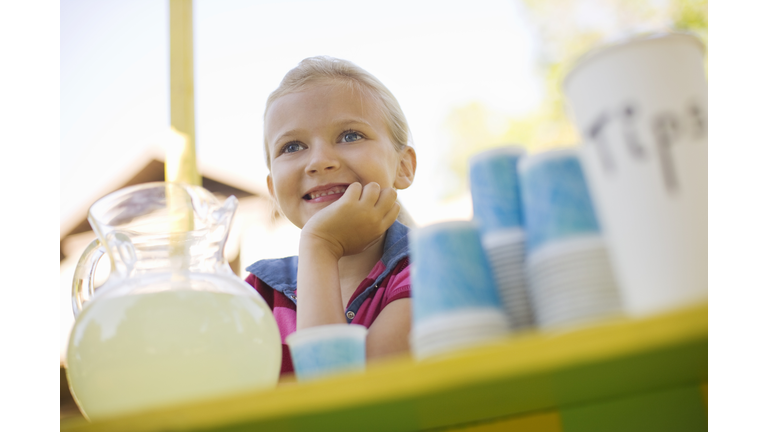 Smiling girl at lemonade stand