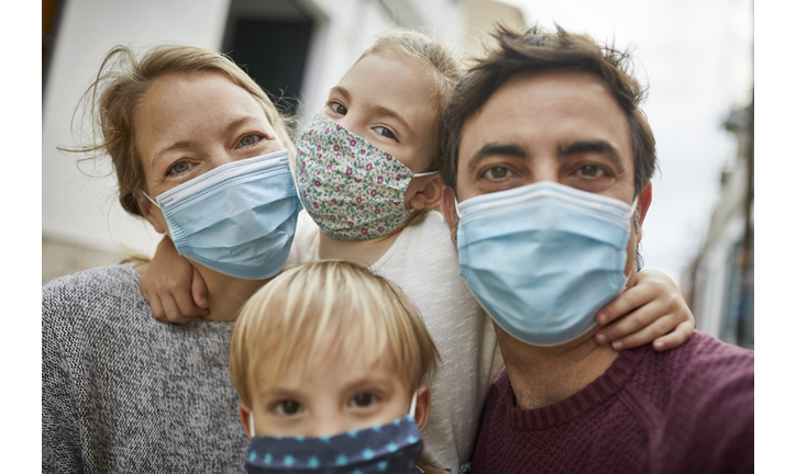 Real Family Taking a Selfie Together While Wearing Protective Face Masks