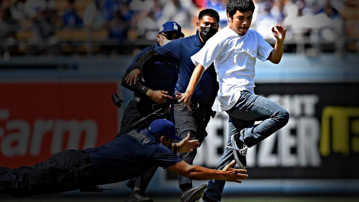 Dodgers ball girl destroys intruding fan for running on the field (Video)