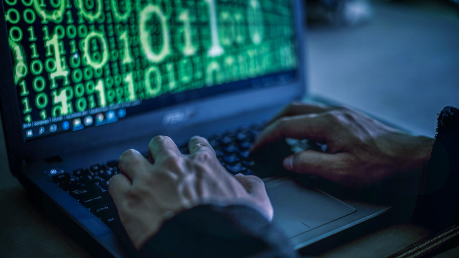 Hacker stealing password and identity, computer crime.