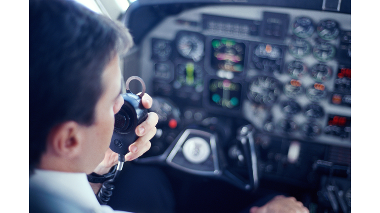 AIRPLANE PILOT TALKING ON RADIO