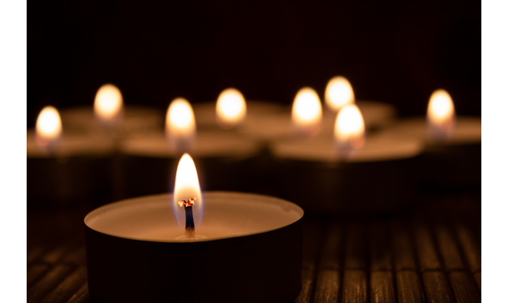 Close-Up Of Lit Candles In Darkroom