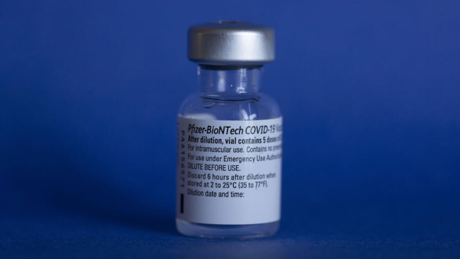 Corona pandemic worldwide.Pfizer/BioNTech vaccination vial.
