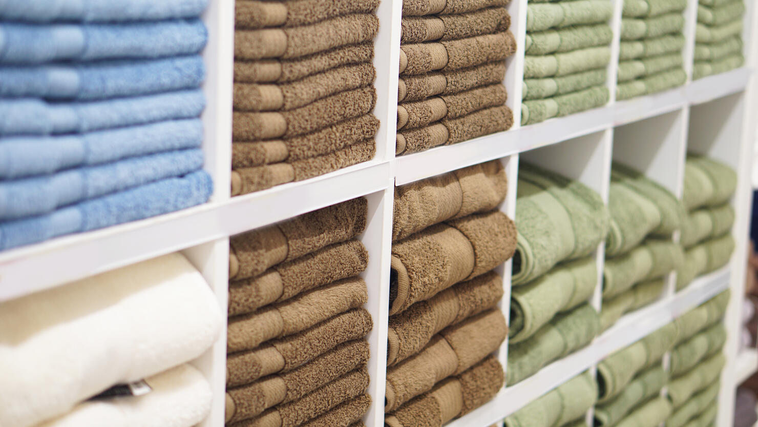 Stack Of Multi Colored Folded Towels For Sale In Store