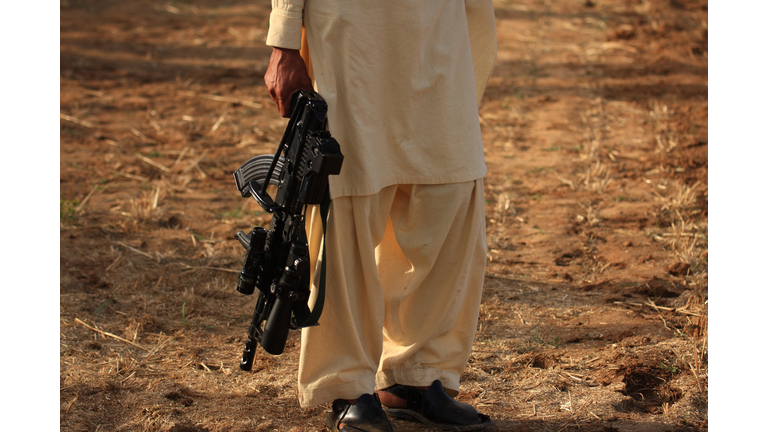 Taliban carrying a gun