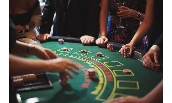 Cropped Image Of People Playing Poker