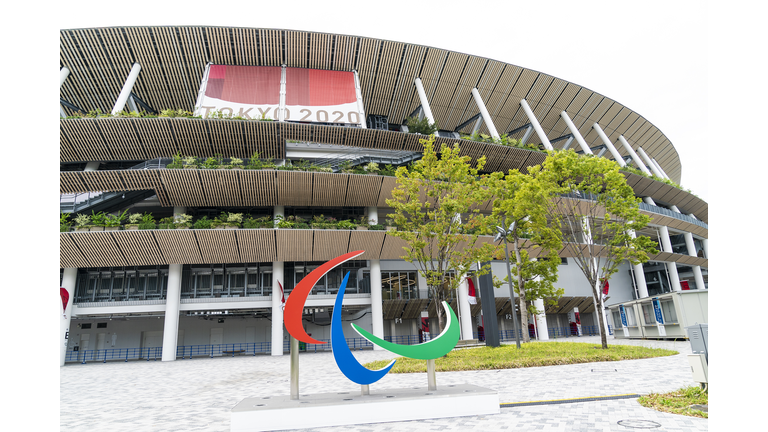 Exterior  view of Olympic stadium with sculpture of logo of