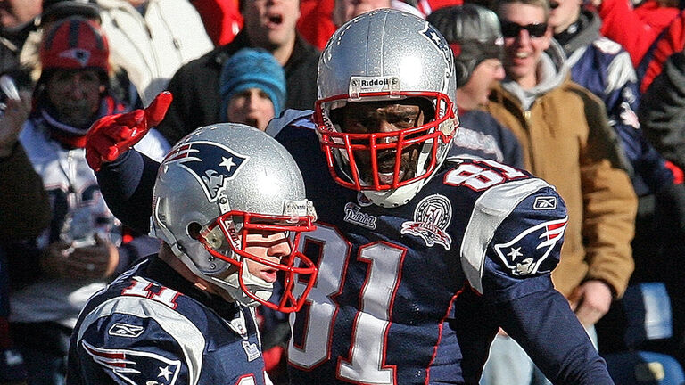 011010 Foxboro, MA)The New England Patriots face off against the Baltimore Ravens in the AFC Wild Card Playoff game at Gillette Stadium.New England Patriots wide receiver Randy Moss celebrates with teammate wide receiver Julian Edelman his 2nd quarte