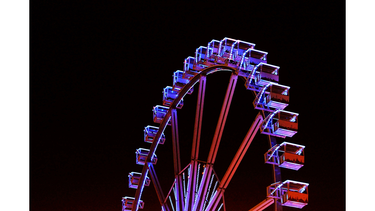 Low Angle View Of Illuminated Ferris Wheel Against Sky At Hamburger Dom