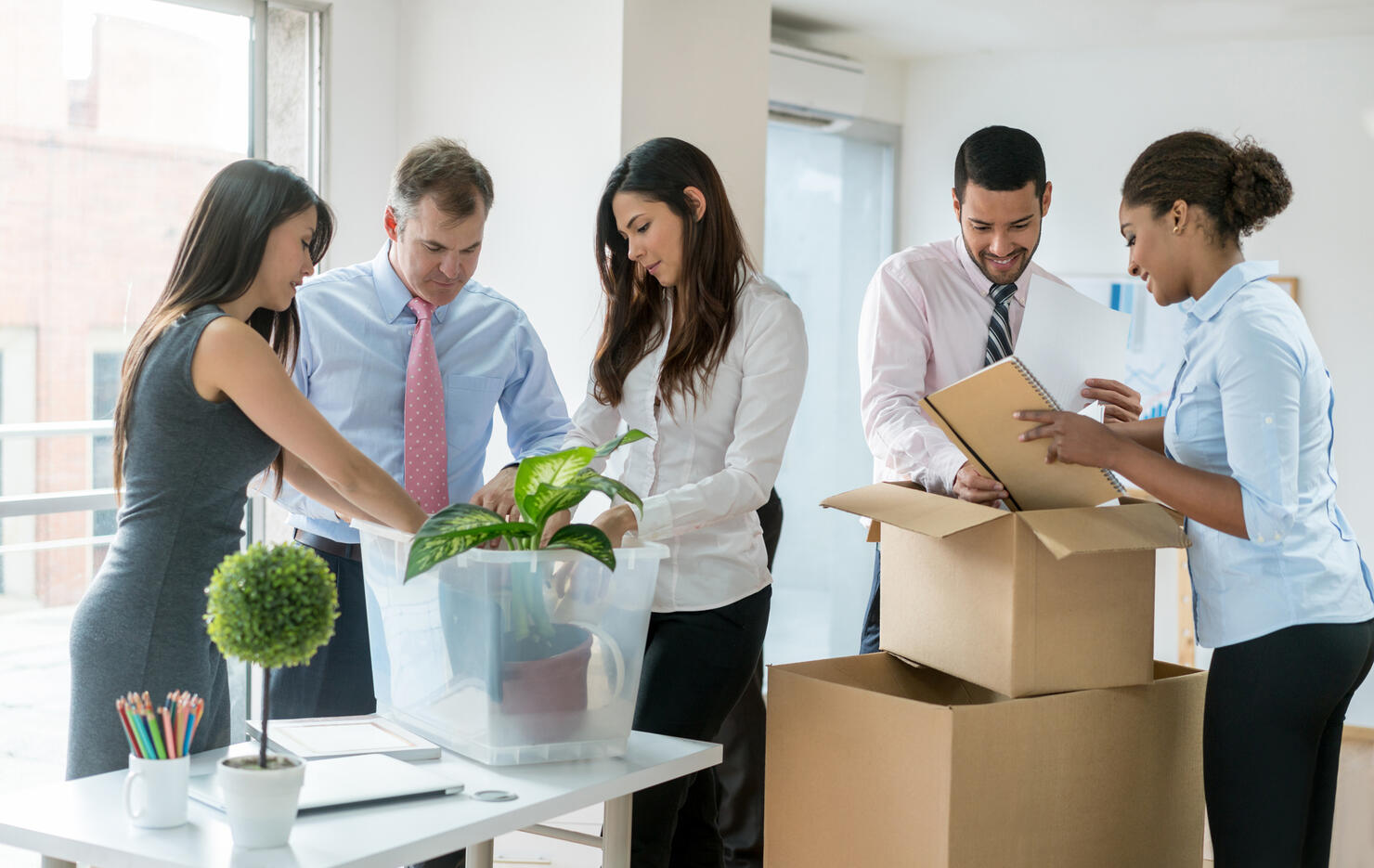 Business people moving and packing in boxes